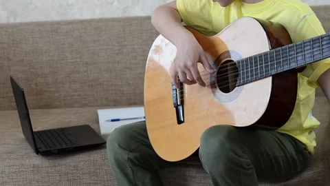 Child playing guitar Stock Footage 152802866