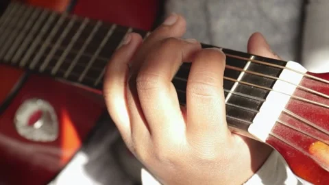 Child playing guitar Stock Footage 164324798