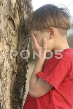 Child playing hide and seek Stock Photos