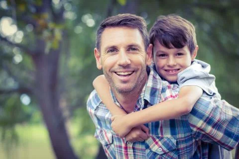 Child playing with his father Stock Photos
