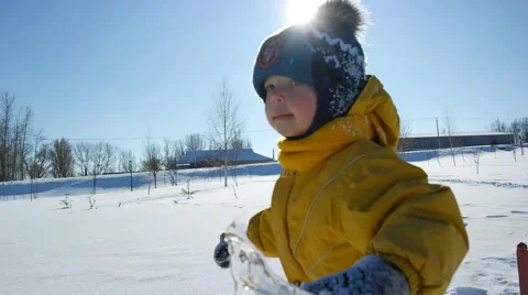 Child playing with icicle in the winter 스톡 동영상 52717468