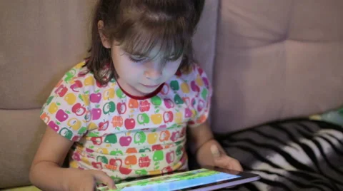 Child playing on ipad tablet pc at home 動画素材 57102558