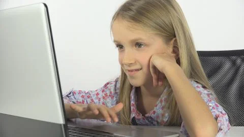 Child Playing at Laptop, Kid Studying PC, Girl Portrait Learning in School Class Stock Photos