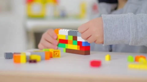 Child playing with lego bricks, close up Video stock 55689544