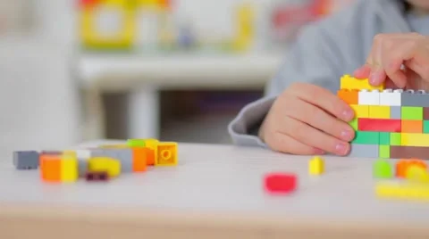 Child playing with lego bricks, close up Video stock 55689684