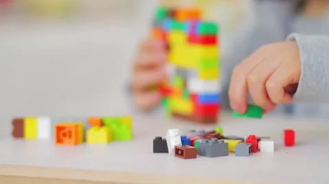 Child playing with lego bricks, close up Video stock 55689725