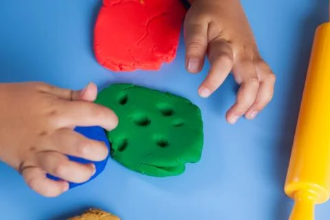 Child playing with modeling clay Stock Photos