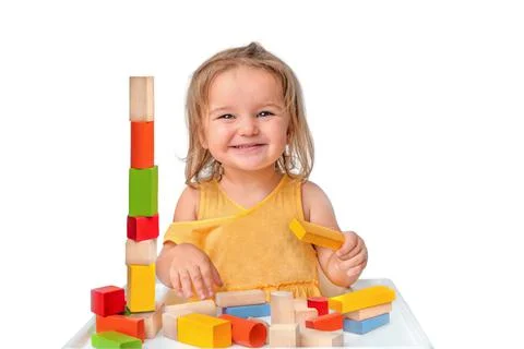 Child playing with multicolored wooden constructor isolated Stock Photos