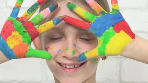 Child Playing Painted Hands, Kid Looking in Camera, Smiling School Girl Face Stock Footage 345155067