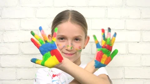 Child Playing Painted Hands, Kid Looking in Camera, Smiling School Girl Face Stock-Footage 346679278