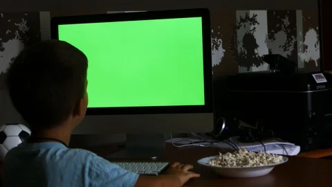 A Child Playing with the PC (green screen) Video stock 113961891