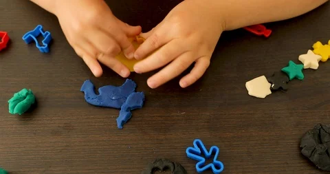 Child playing with plasticine Stock Footage 112602923
