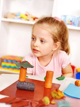 Child playing plasticine. Stock-Fotos