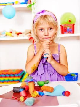Child playing plasticine. Stock Photos