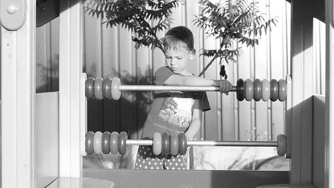 The child is playing on the playground. Stock Footage 77951182
