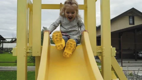 Child playing in the playground Video stock 137875264