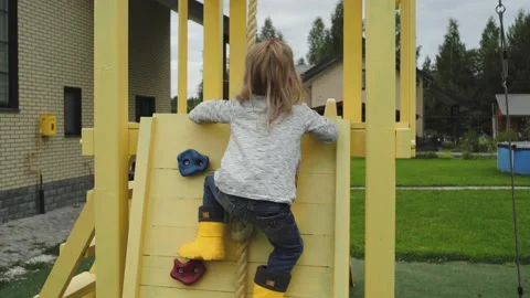 Child playing in the playground Video stock 137875301
