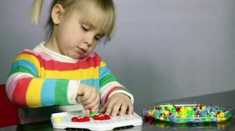 Child playing puzzle game Stock Footage 10566420