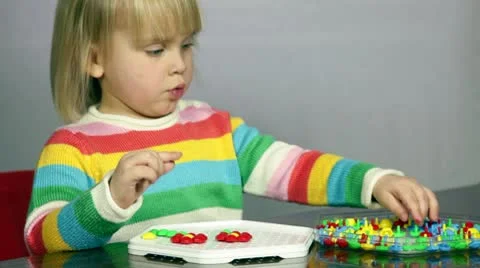 Child playing puzzle game Stock Footage 10571427