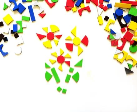 Child playing with puzzle, geometric shape mosaic on the table, a game for .. Foto stock