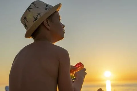 Child playing with a rainbow pop it, presses bubbles. anti-stress toy Foto stock