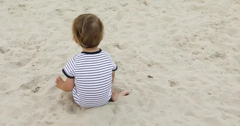 Child playing on the sand back view Video stock 94054116