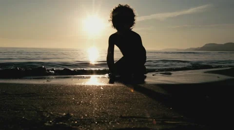 Child playing with sand at the beach Video stock 43088723