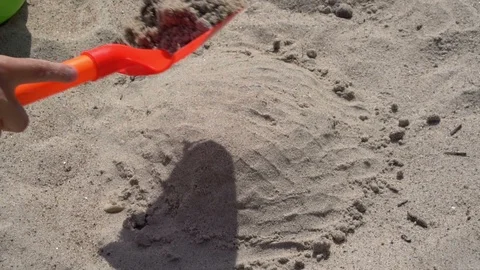 Child playing with sand on the beach Stock Footage 92536996