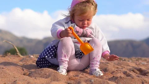 Child playing on the sand Stock Footage 95269909