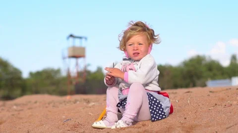 Child playing on the sand Stock Footage 96676652