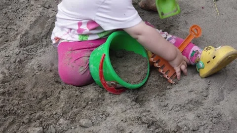 Child playing with sand Stock Footage 242722130