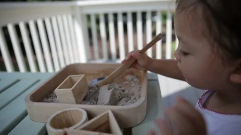 Child Playing with Sand Outside Stock Footage 91748144