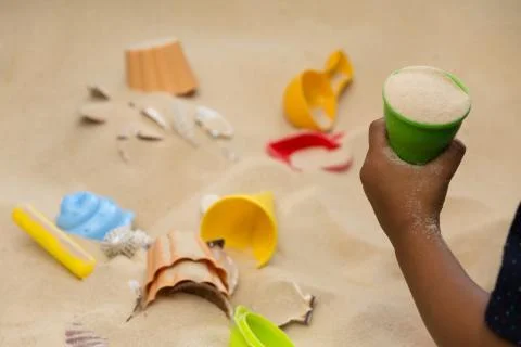 Child Playing In The Sand Stock Photos