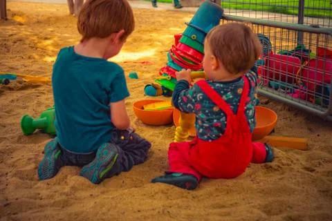 Child is playing in the sand Stock Photos