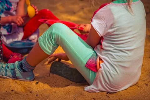 Child is playing in the sand Stock Photos