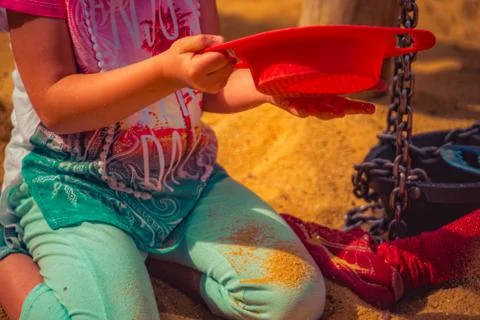 Child is playing in the sand Stock Photos