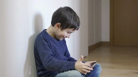 Child playing with smartphone Stock-Footage 263899481