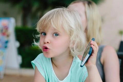 Child playing with smartphone Foto stock
