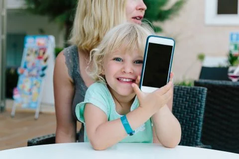 Child playing with smartphone Stock Photos