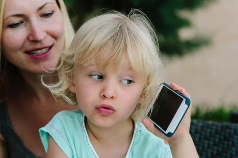 Child playing with smartphone Foto stock