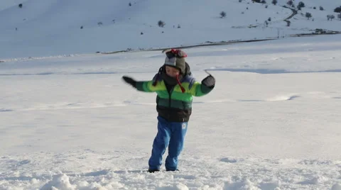 Child playing in the snow Stock Footage 46680839
