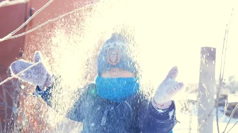 Child playing with snow in the winter Stockbeeldmateriaal 52270098