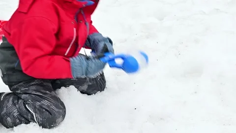 Child Playing Snow in Winter, Making Snowball Stock Footage 229063884