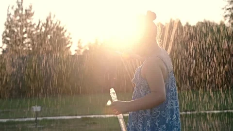 Child playing with soap bubbles in summer on the grass at sunset close-up.  Stock Footage 272297378