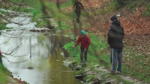 Child playing by a stream Stock Footage 166222225