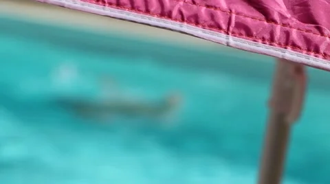 Child playing in a swimming pool 動画素材 51694078
