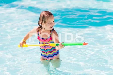 Child playing in swimming pool Stock Photos