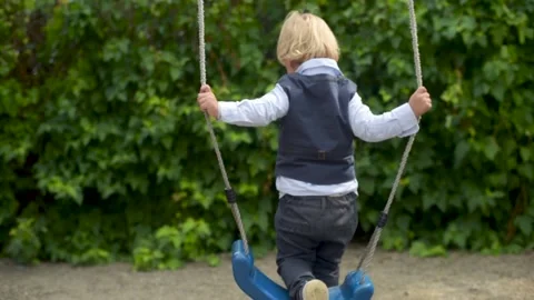 Child playing with swing outdoor. Stock Footage 161413037