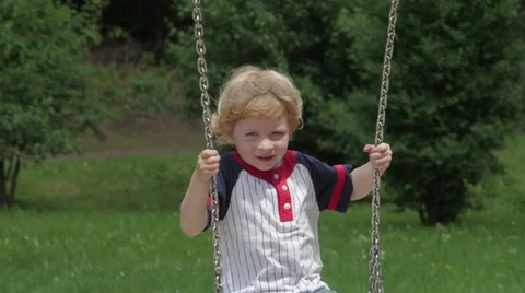Child Playing On Swings 스톡 동영상 63923441