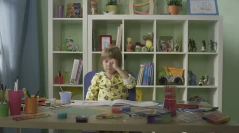 Child playing at the table Stock Footage 12575300